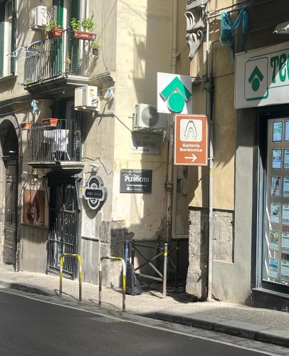 a street sign on the side of a building at Casetta Piazza Plebiscito in Naples