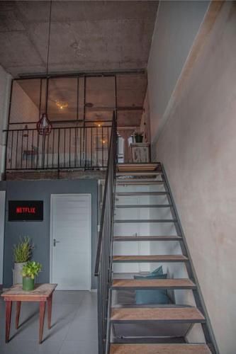 a spiral staircase in a room with a stair case at Kape Loft in Cape Town