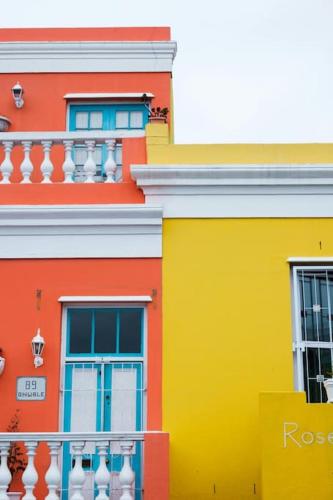 a colorful building with windows and a balcony at Kape Loft in Cape Town