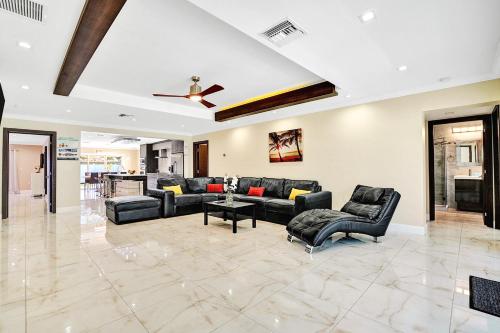 a living room with couches and a ceiling at Luxury 4BR & 4BA Villa Heated Pool Minutes To Beach in Hollywood