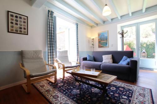a living room with a couch and a table at Chez requenna in Borce
