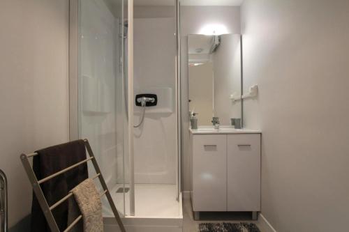 a bathroom with a shower and a sink at Chez zézé in Asson