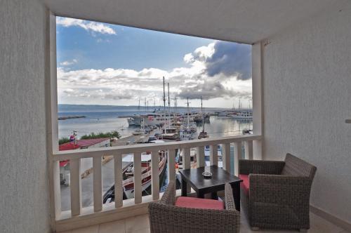 a balcony with a view of a marina at Hotel Krilo in Podstrana