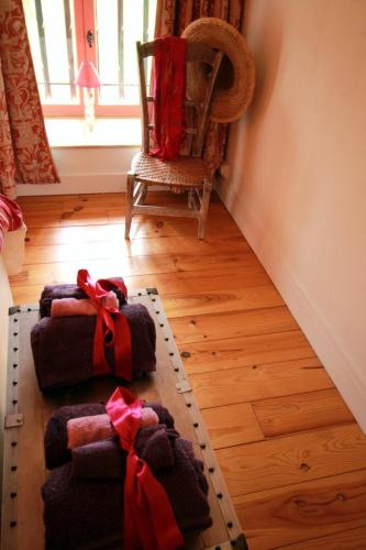 a living room with a couch and a chair at Les moissonneurs in Champagnac-la-Rivière