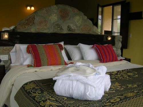 Una cama o camas en una habitación de Apart Los Antiguos