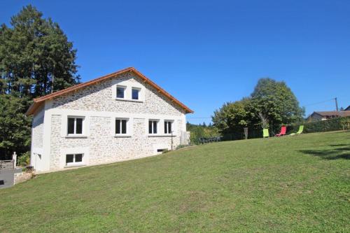 a house on top of a grassy hill at Le picatao, les flamanchies in Saint-Mathieu