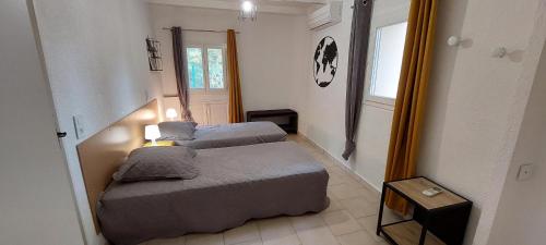 Postel nebo postele na pokoji v ubytování Un coin tranquille