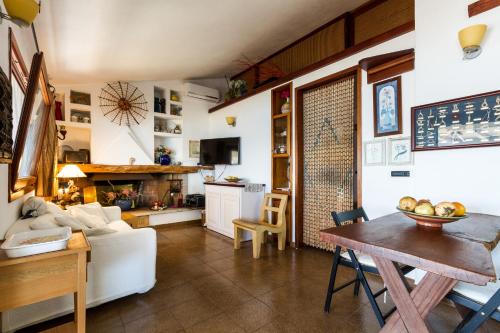 a living room with a white couch and a table at Molarotto in Porto Taverna