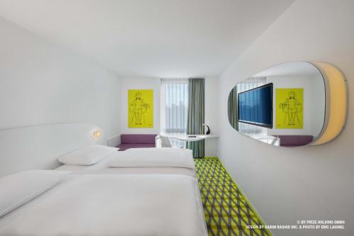 Кровать или кровати в номере Prize by Radisson, Bremen City
