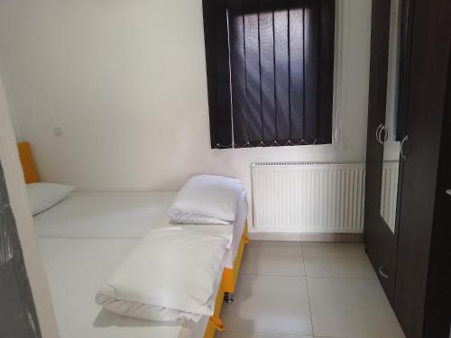 Postel nebo postele na pokoji v ubytování Apartmani Natura