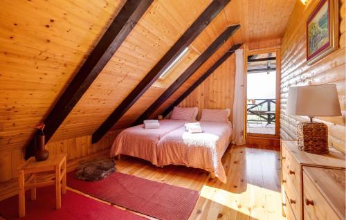 a bedroom with a bed in a wooden cabin at Beautiful Home In Samobor With Kitchen in Samobor