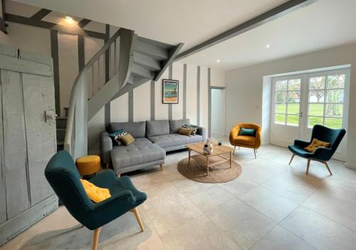 a living room with a couch and chairs at Trebuc in Labastide-Clairence