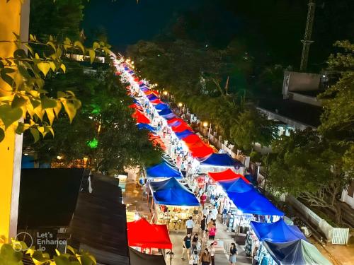 an overhead view of a street with colorful umbrellas at Meunna Boutique Hotel in Luang Prabang