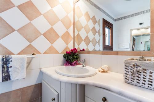a bathroom with a sink and a mirror at Molarotto in Porto Taverna