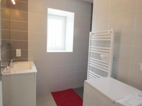 a bathroom with a toilet and a sink at Chez regine in Angoumé