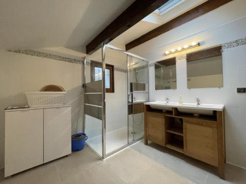 a bathroom with a sink and a shower at Iparla in Urrugne