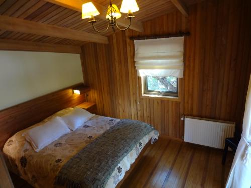 Cama o camas de una habitación en Cabañas Las Cabras