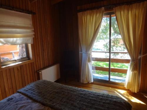 Cama o camas de una habitación en Cabañas Las Cabras