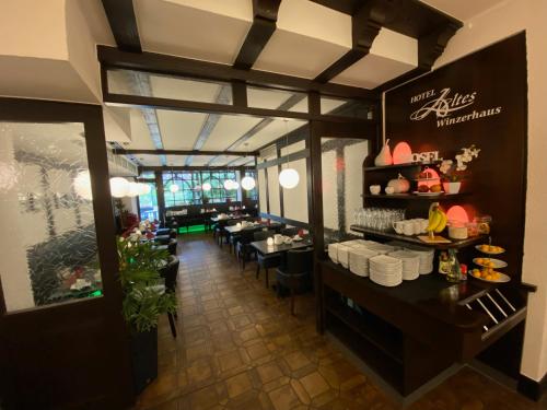 an overhead view of a restaurant with tables and chairs at Hotel Altes Winzerhaus in Cochem