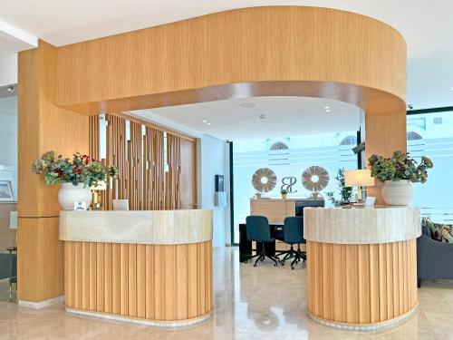 an office lobby with a table and chairs at Soho Boutique Tetuán in Tetouan
