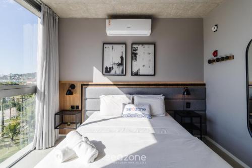 Cama o camas de una habitación en Spot Jurere sofisticación junto al mar - SPJ's