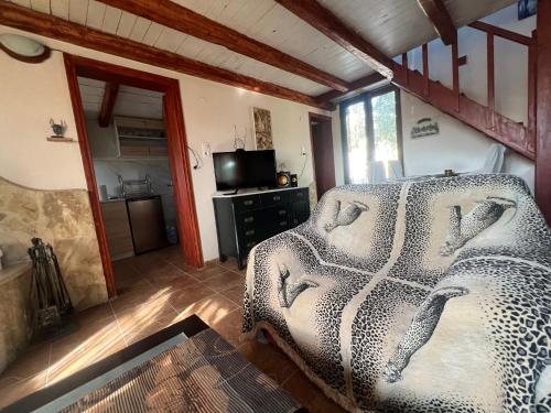 a bedroom with a leopard print bed in a room at Country house in nature in Heraklion