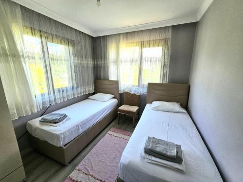 Postel nebo postele na pokoji v ubytování Çalık Villa Trabzon61