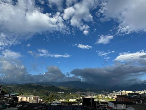 a view of a city under a cloudy sky at MARGARETH in Manizales