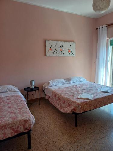 Postel nebo postele na pokoji v ubytování Appartamento IBIS - Affitti Brevi Italia