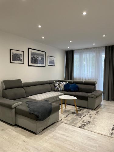 a living room with a couch and a table at Apartman Rita in Livno