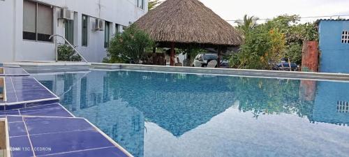 Bazén v ubytování Tolú mágico, apartamentos amoblados con vista al mar, Elegancia y comodidad nebo v jeho okolí