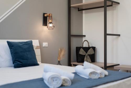 a bedroom with a bed with two towels on it at Bed and Breakfast Da Francesca in Castelluzzo