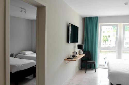 Una cama o camas en una habitación de Hotel LA PLAGE