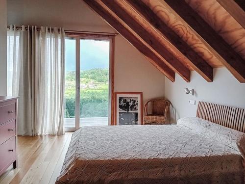 Ένα ή περισσότερα κρεβάτια σε δωμάτιο στο Casa A Criscada