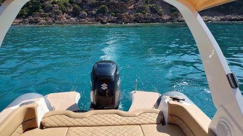 a motor on the back of a boat in the water at I Ginepri B&B in Portoscuso
