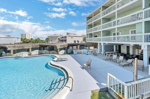 a swimming pool in front of a building at Docks 12C in Pensacola