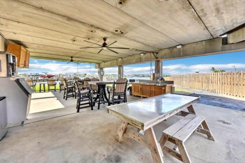 a patio with a table and chairs and a kitchen at Docks 12C in Pensacola