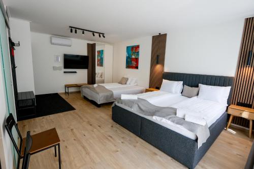 Postel nebo postele na pokoji v ubytování Gyulai Várpark Apartman
