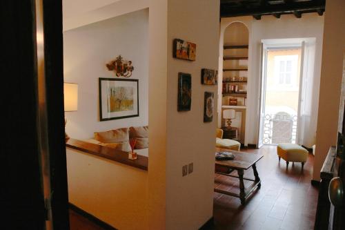 a living room with a couch and a table at Domus Antonella a Trastevere in Rome