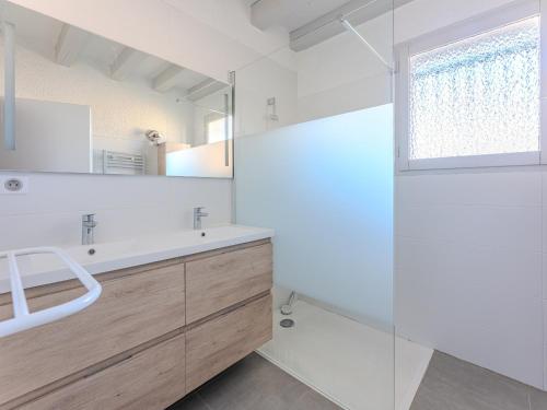 a white bathroom with a sink and a shower at Maison 3 chambres avec jardin, proche plage et centre, Biscarrosse-Plage - FR-1-521-35 in Biscarrosse-Plage