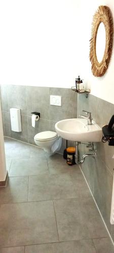 a bathroom with a sink and a toilet at TopFlat in Dortmund