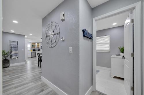 a hallway with a door leading to a dining room at Family Fun Retreat with Heated Pool and Game Room in Largo