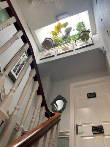 a stairway with potted plants and a window at ParkRoyal Blackpool in Blackpool