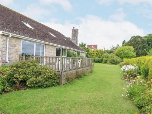 a house with a fence and a yard at Glyde House in Dorchester