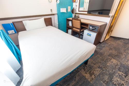 Un ou plusieurs lits dans un hébergement de l'établissement Toyoko INN Marseille Saint Charles