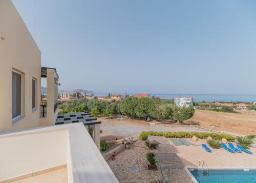 a view of the pool from the balcony of a house at Apartments Hotel & Studios, Xifoupolis in Monemvasia