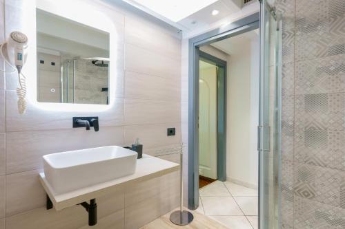 a bathroom with a sink and a shower at Unplug in Quartu SantʼElena