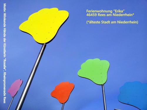 a book cover with four colorful trees at Ferienwohnung "Erika" Rees am Niederrhein in Rees