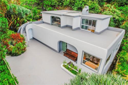an aerial view of a white house at Flores Garden Retreat in Santa Cruz das Flores