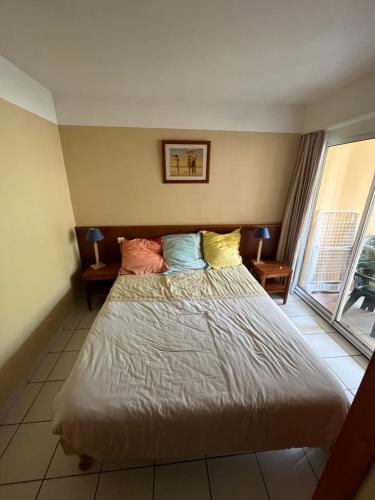 Katil atau katil-katil dalam bilik di Résidence les grands pins, appartement Maubuisson